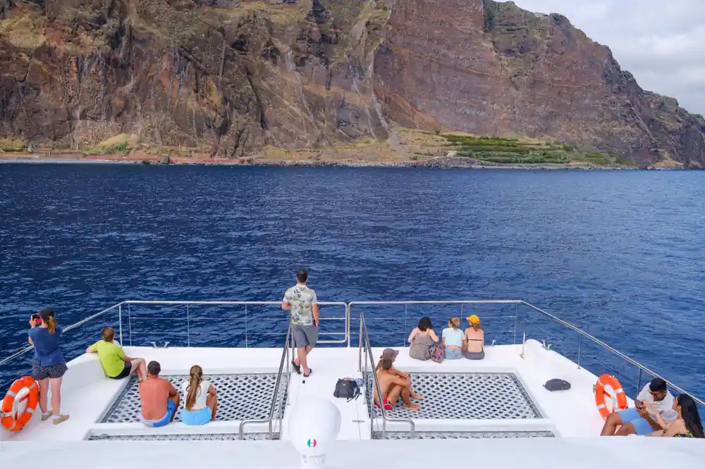 Guests spread across the foredeck nets and seating