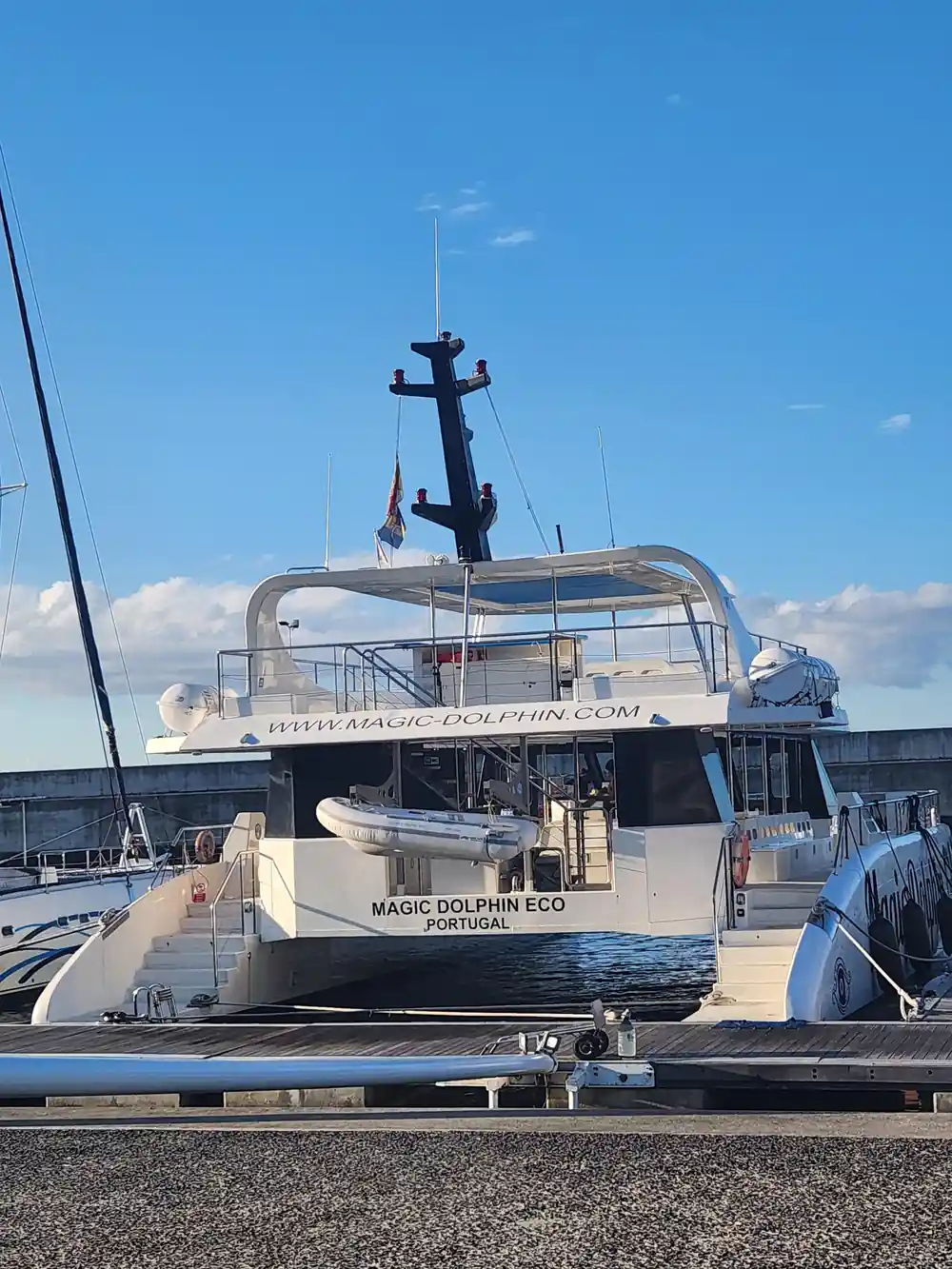 The Magic Dolphin Eco moored at the marina pontoon