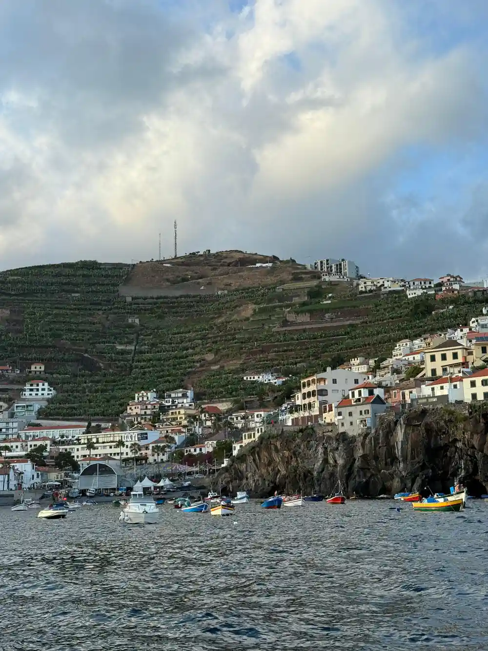 A terraced hillside village above the water